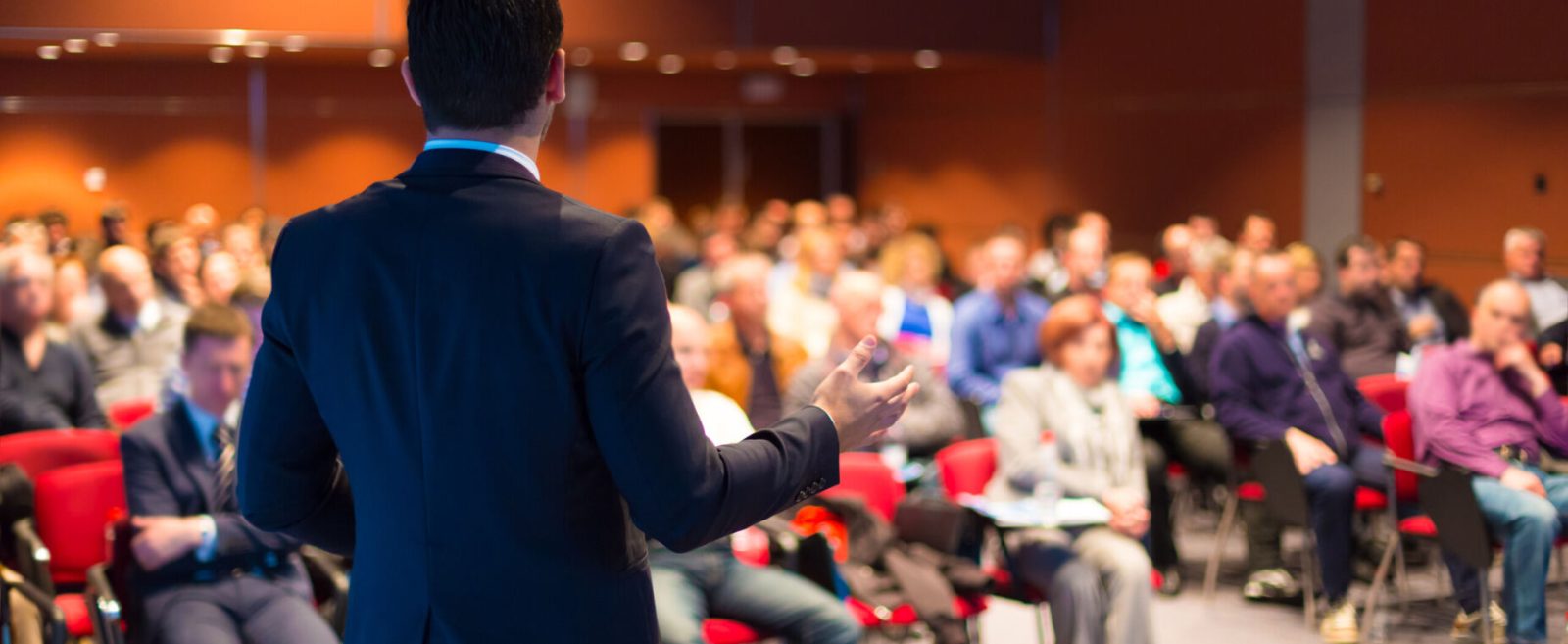 Person speaking at a conference