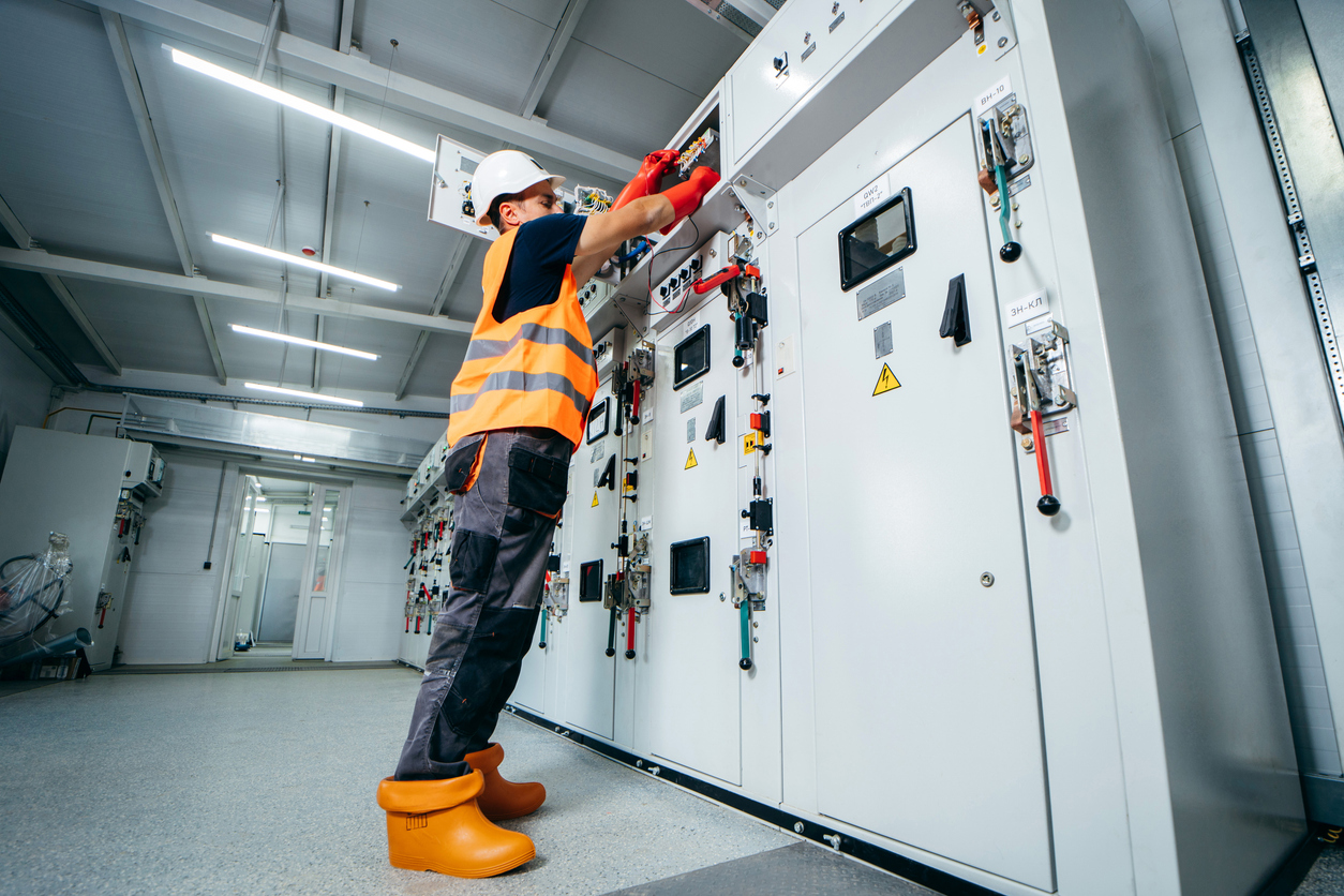 Engineer inspecting power station equipment
