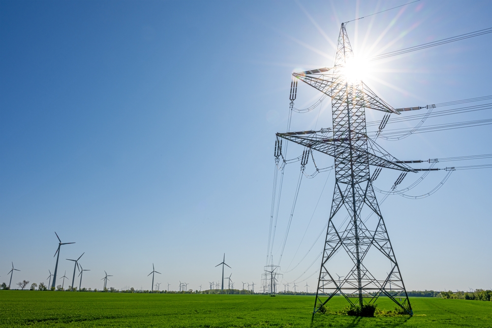 Transmission lines with sun behind them